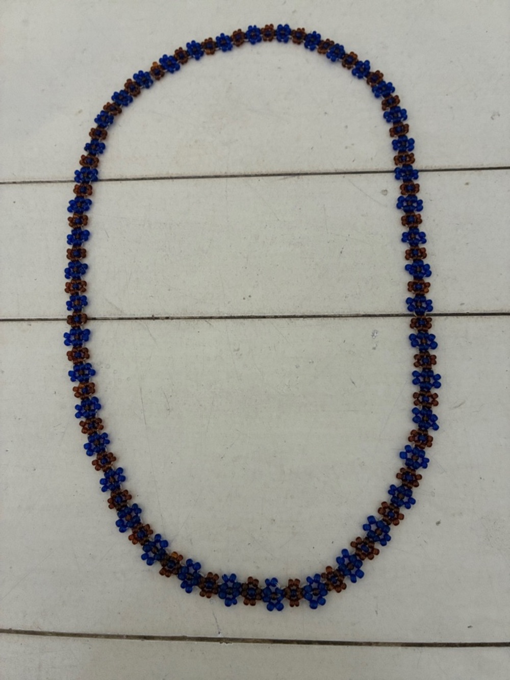 Handmade Daisy continuous beaded daisy necklace.